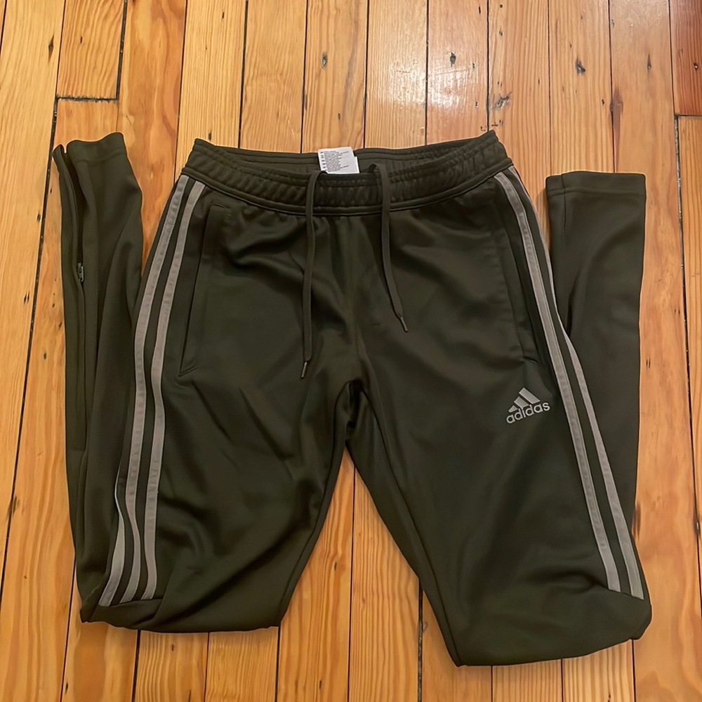 Women’s army green Adidas track pant.